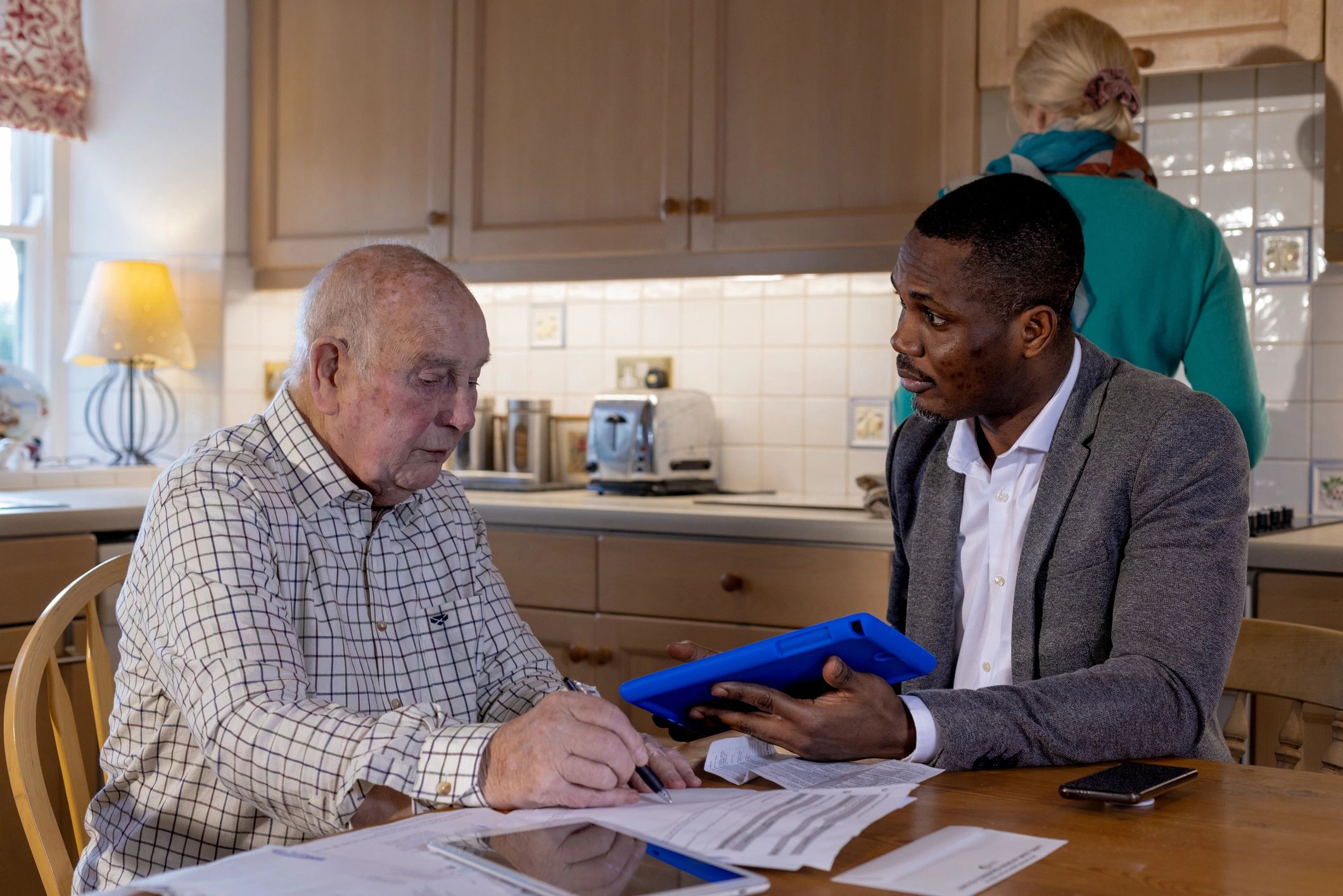 Family reviewing care and insurance paperwork together